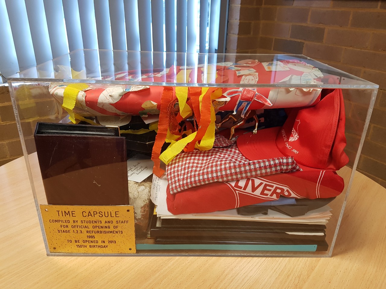 Image of the 1995 time capsule just before opening at the school's 150th anniversary - 2013.